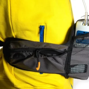 Inogen Rove 4 waist bag worn on a yellow jacket, device visible with c