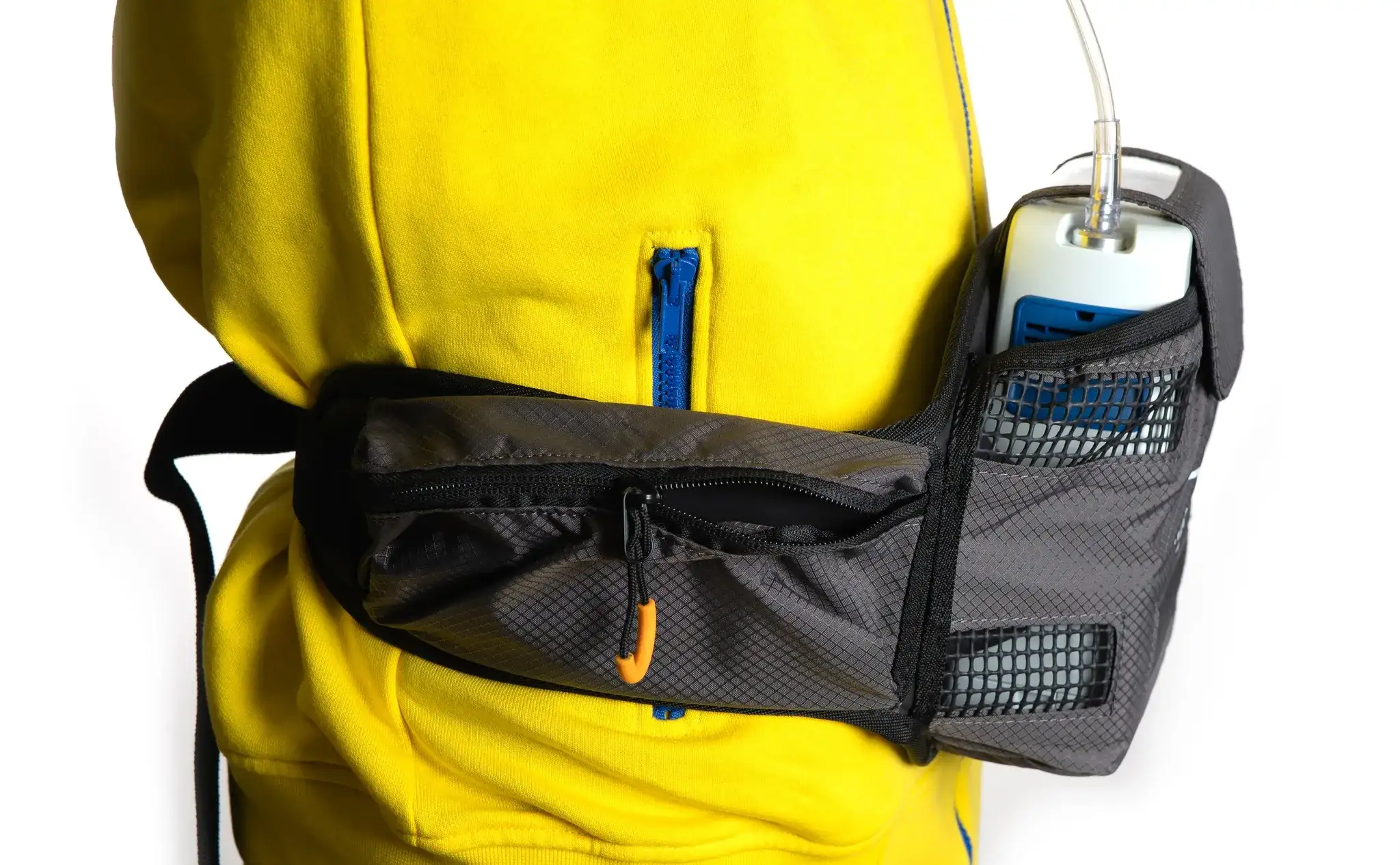 Inogen Rove 4 waist bag worn on a yellow jacket, device visible with c
